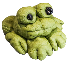 uncooked green dough in the shape of a frog
