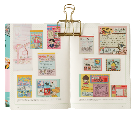book spread with vintage stationery items